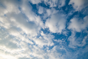 blue sky background with tiny clouds