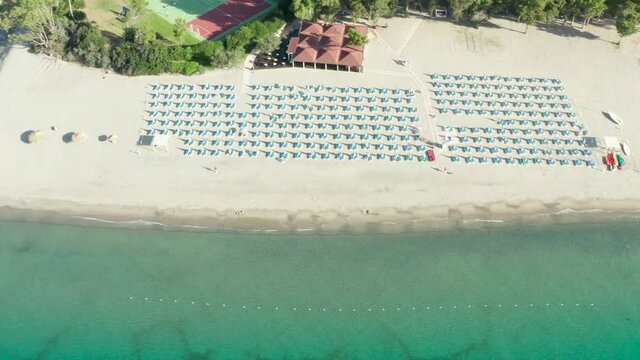 Aerial view of beautiful sea and beach with parasol at sunny day, Simeri Mare, Calabria, Southern Italy
