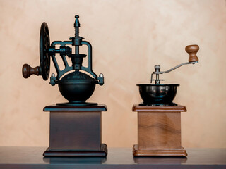 Vintage coffee grinder. Two manual coffee grinders for grinding coffee beans on table.