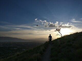 silhouette of a person in the mountains