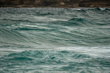 waves in the rough seas on a stormy day