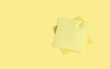 yellow sticky note with clip