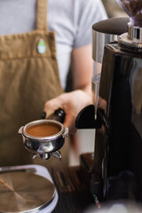 Unrecognizable Person preparing coffee with a filter