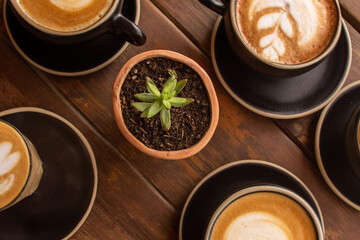 Coffee cups on a wooden background