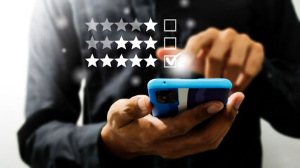 Customer Experience for Goods services Concept, Best Excellent Services Rating for Satisfaction present by hand of Client pressing Five Star and smile face.