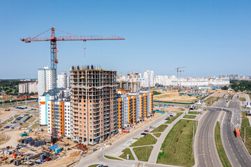 Fototapeta na wymiar aerial view of new high-rise apartment building under construction. development of city residential area.