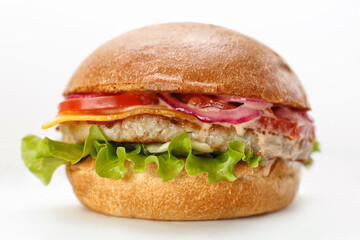 fresh cheeseburger with tomato and beef on white background