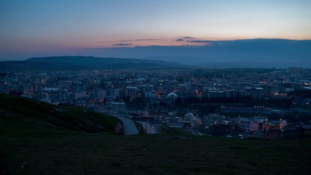 Siirt city in Turkey day to night timelapse with a view to the whole city during sunset.