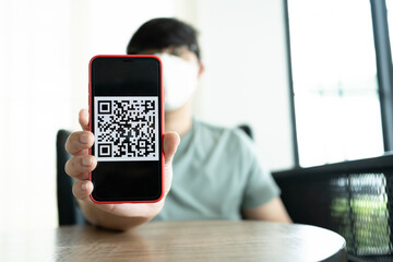 Qr code payment. E wallet. Man scanning tag accepted generate digital pay without money.scanning QR code online shopping cashless payment and verification technology concept