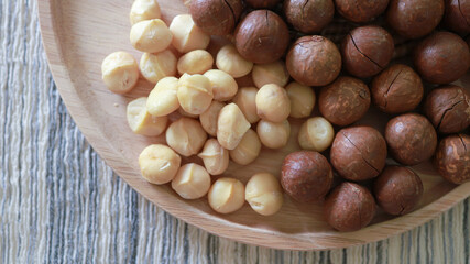 Organic Macadamia nut. macadamia nuts are cracked and baked to taste extremely delicious superfood fresh natural shelled unsalted raw macadamia and healthy food concept