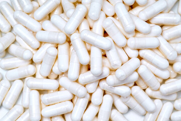 marine magnesium capsules on white background with advertising copy space. top view