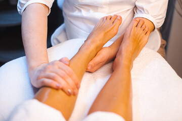 Obraz na płótnie Canvas Woman legs spa treatment. Medical treatment. Body spa massage. Natural luxury.