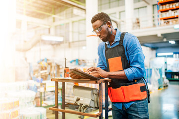 Technician working in factory check functionality while commissioning a production line, Man working