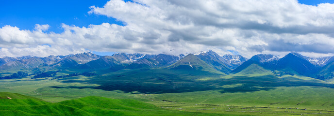 Fototapeta na wymiar Nalati grassland with beautiful mountain natural landscape in Xinjiang,China.