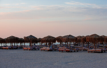 In the morning among the umbrellas on the beach