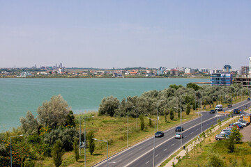 Fototapeta na wymiar Landscape with the boulevard in Mamaia resort and Siutghiol lake - Romania