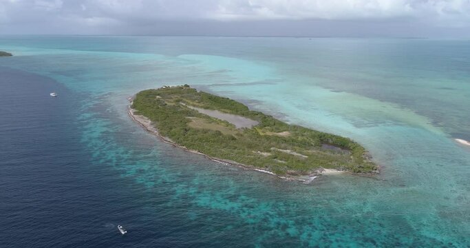 Aerial view drone moving backwards. right turn paradise island coral reef Maseta Cote island. los roques venezuela Caribbean Sea