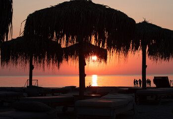 A sunrise seen from the beach of the sea