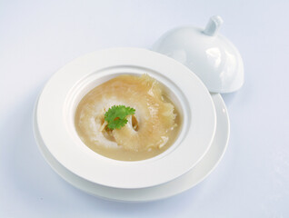 braised superior whole shark's fin thick soup with golden stock seafood in white background asian halal menu