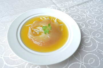 braised superior whole shark's fin thick soup with golden stock seafood in white background asian halal menu