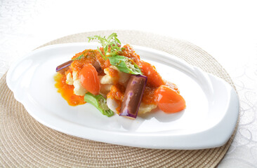 deep fried fish fillet seafood with vegetables eggplant in spicy chilli nonya sauce in white background asian halal menu