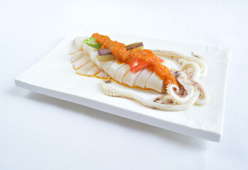 steamed fresh octopus squid in spicy nyonya chilli sambal sauce seafood in white background asian halal menu