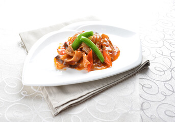 stir fried octopus squid with vegetable in spicy sambal chili sauce seafood in white background asian halal menu