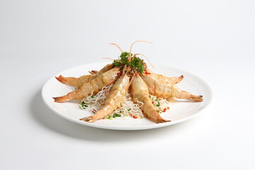 deep fried crispy big fresh tiger prawn in spicy chilli curry sauce in hot clay pot in white background asian halal menu