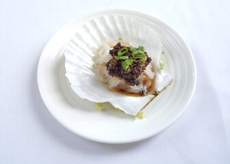 steamed scallop with vermicelli in shell with chef special black bean soy sauce seafood in white background asian halal menu