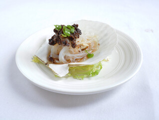 steamed scallop with vermicelli in shell with chef special black bean soy sauce seafood in white background asian halal menu