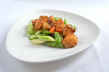 stir fried scallop with vegetables in spicy samba xo chilli sauce seafood in white background asian halal menu