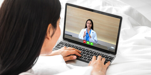 Woman talk speak using laptop computer and video conference online with doctor and stethoscope service help support team discussing and consulting talk video chat call checkup information at home