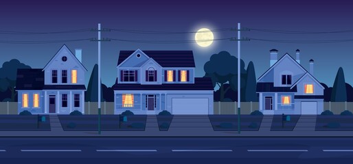 Street in suburb district with houses at night