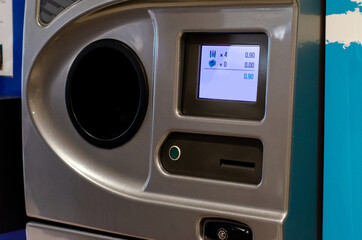 A reverse vending machine is a device that accepts used (empty) beverage containers and returns money to the user.