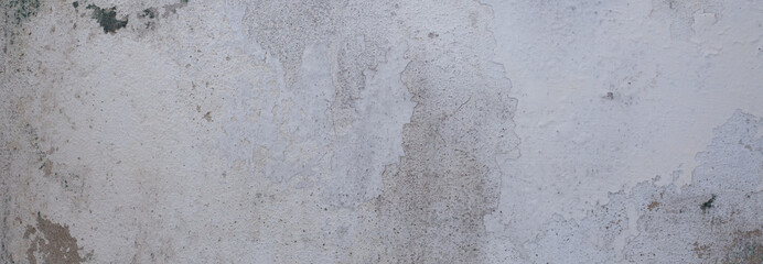 Old gray wall. The floor and the walls are cracked. Design background image.