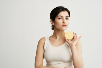 pretty woman clinking in hands in white t-shirt clean skin health