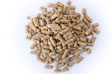 Pile of compound feed pellets isolated on white.   Animal feed.