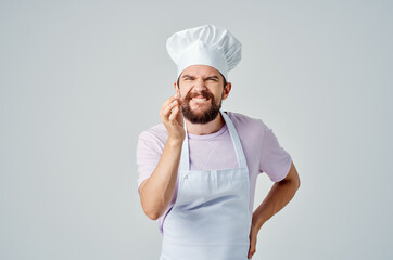 emotional male chef working in a restaurant kitchen service