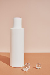 Natural cosmetic product. White bottle on pastel background