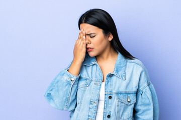 Young latin woman woman over isolated background with headache