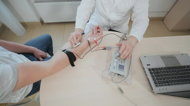 Patient nerves testing using electromyography at medical center