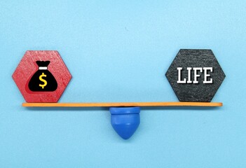 hexagon with a stable weight of the words money and life Or work, life And balance