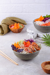 Hawaiian poke bowl with salmon and shrimps