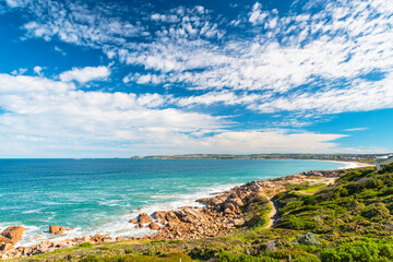 Port Elliot with the Heritage trail running along picturesque coastline viewed from the Freeman Nob lookout on a bright day, Fleurieu Peninsula, South Australia