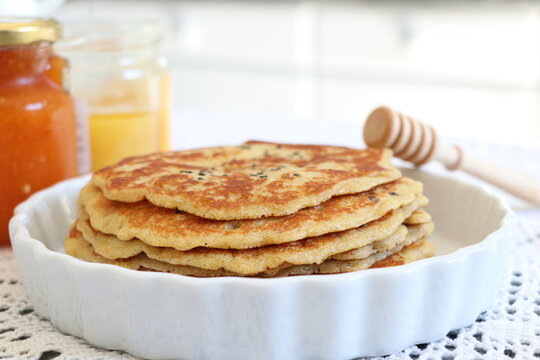 image of pancakes with coffee and yam, honey for accompany isolated background.