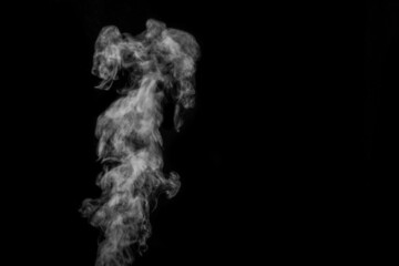 Perfect mystical curly white steam or smoke isolated on black background. Abstract background fog or smog