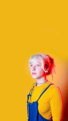 young caucasian woman isolated posing looking away pensive and dreaming on copyspace background vertical banner