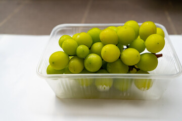 Fresh ripe juicy sweet green grapes  brunch fruit on isolated white background.
