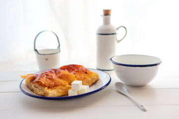 Traditional Bulgarian banitsa of handmade pastry leaves stuffed with bulgarian milk yogurt, white cheese and butter. Useful breakfast for Bulgaria.