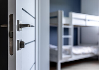 Close-up of metal doorknob on blurred background of home interior.